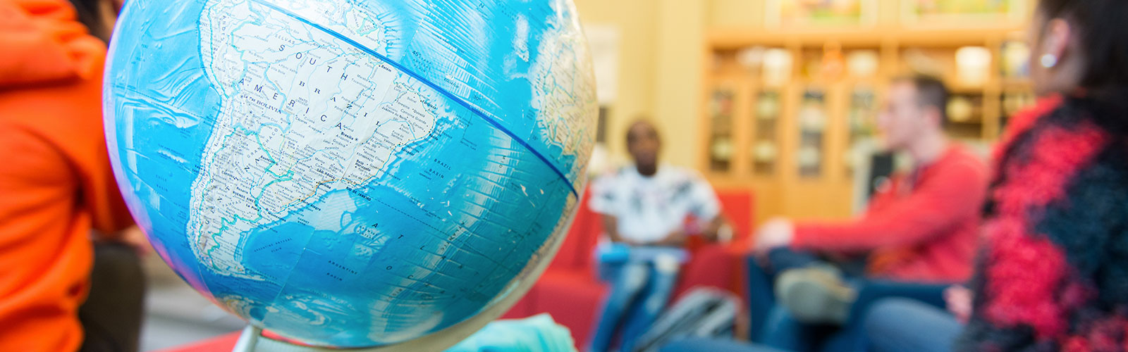world globe sitting on a table in a classroom